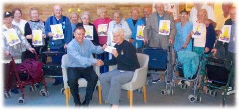 Uniscan Limited handing sponsorship cheque to Queens Park Court